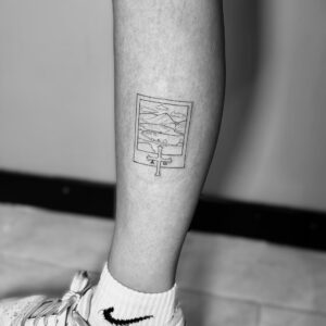 Tatuaje de fotografía en la pierna